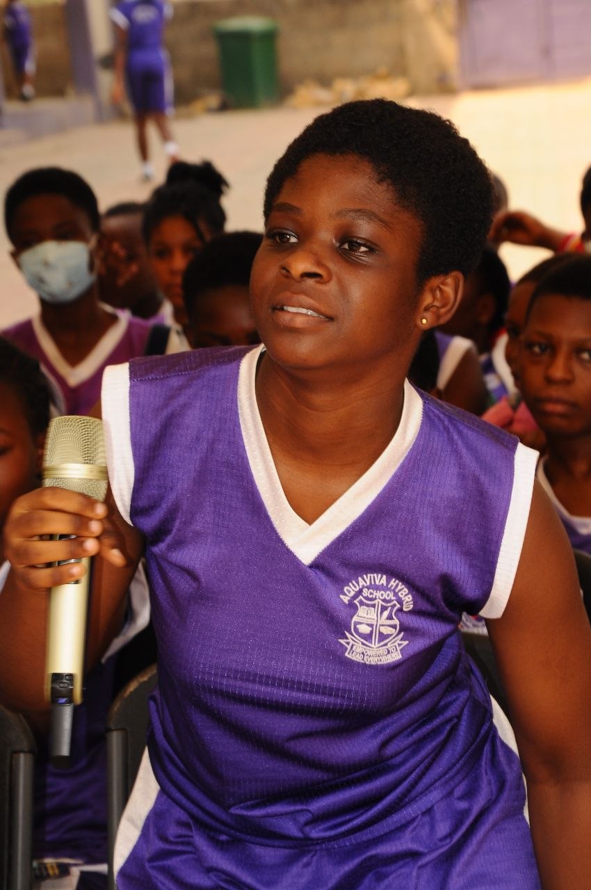 Student receiving visible school support during an activity
