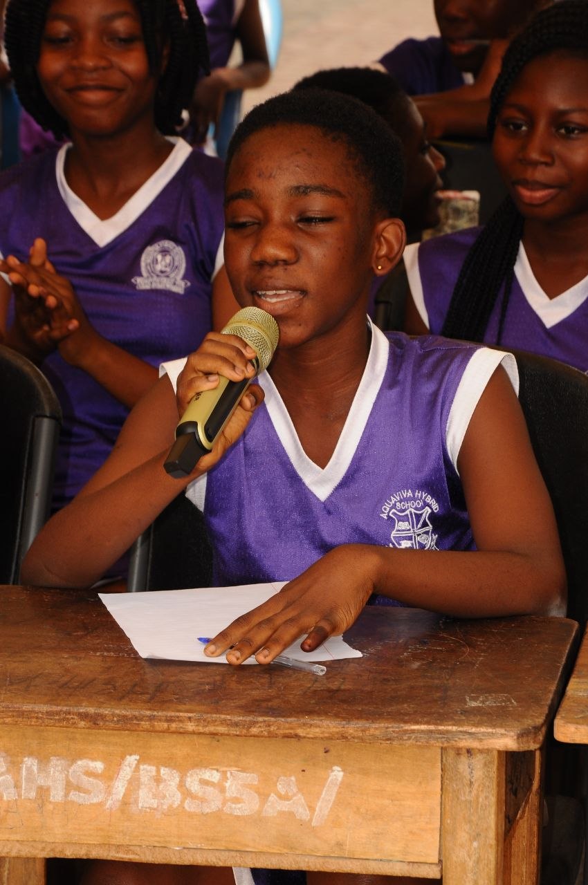 Student speaking into microphone during session