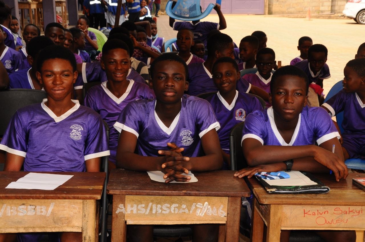 Students writing in class during a lesson